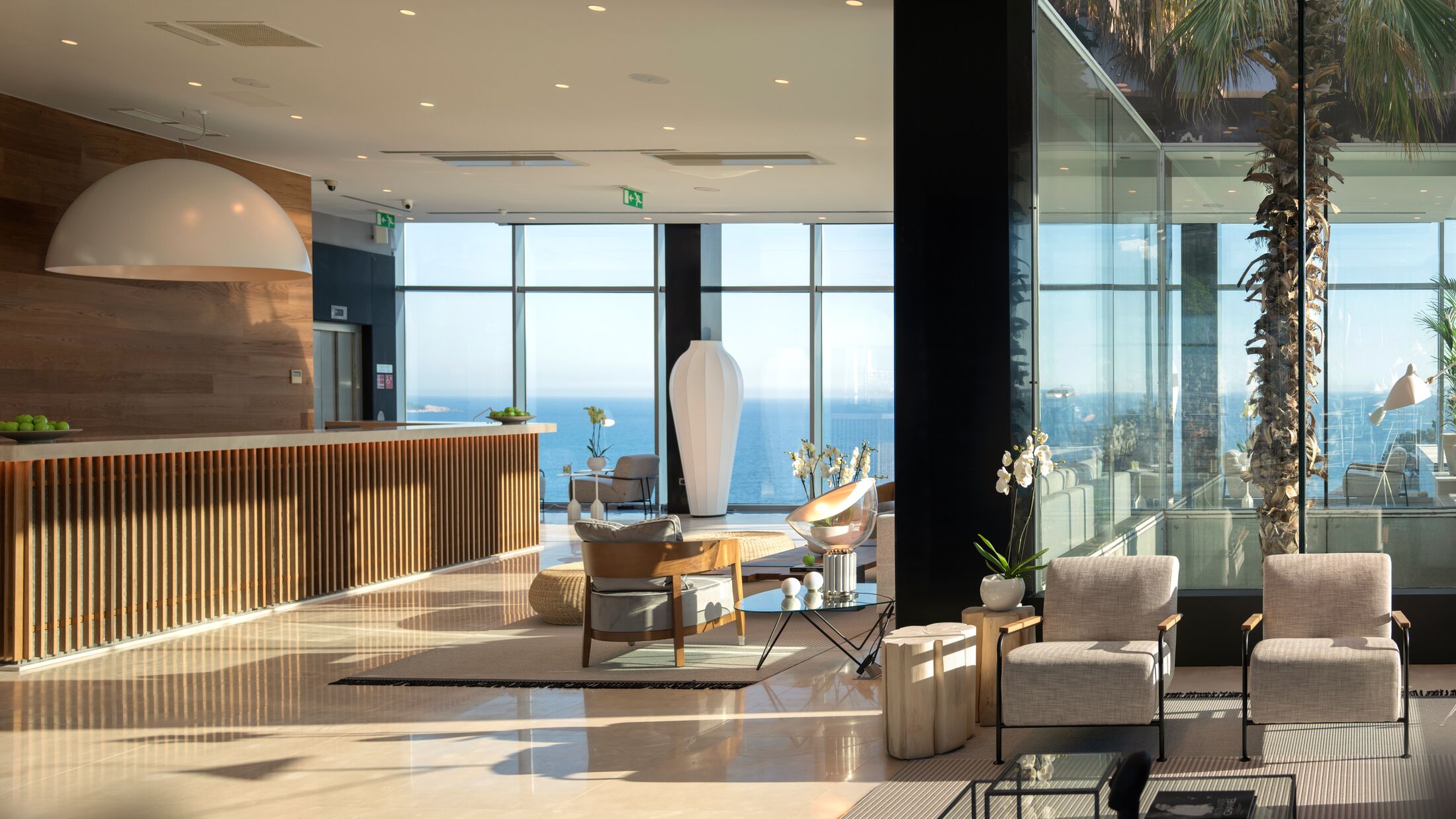 a living room filled with furniture and a large window